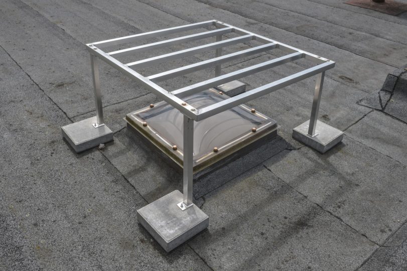 hekwerk op plat dak als koepelafscherming